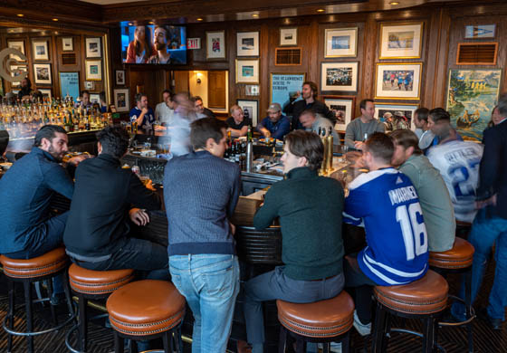 Crowded bar at the Oak Room in the Cambridge Club