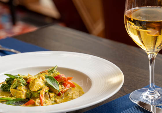 Thai Green Curry - coconut green curry, boneless skinless chicken thigh, long grain rice, snow peas, broccoli, red onions, and red peppers - served in the Oak Room with a glass of white wine at the Cambridge Club