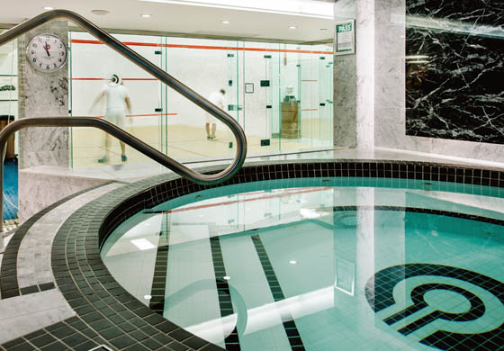 Whirlpool in the Cambridge Club's locker room, with squash game happening in the background