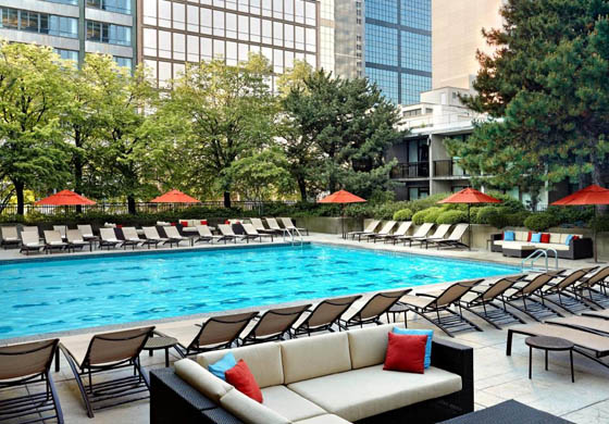 Pool and chairs around the pool at the Sheraton Centre Hotel in downtown Toronto